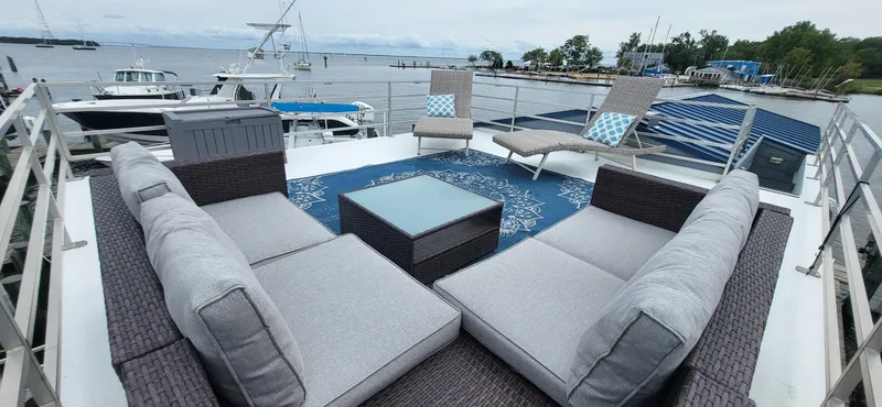  Yacht Photos Pics Luxury rooftop deck on 2020 Destination Yachts 16x45 Condo Series, featuring modern outdoor seating.