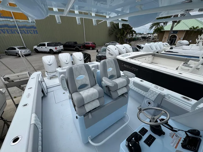 35-261 Yacht Photos Pics 2025 Contender 35 ST boat interior with dual seats and steering console.