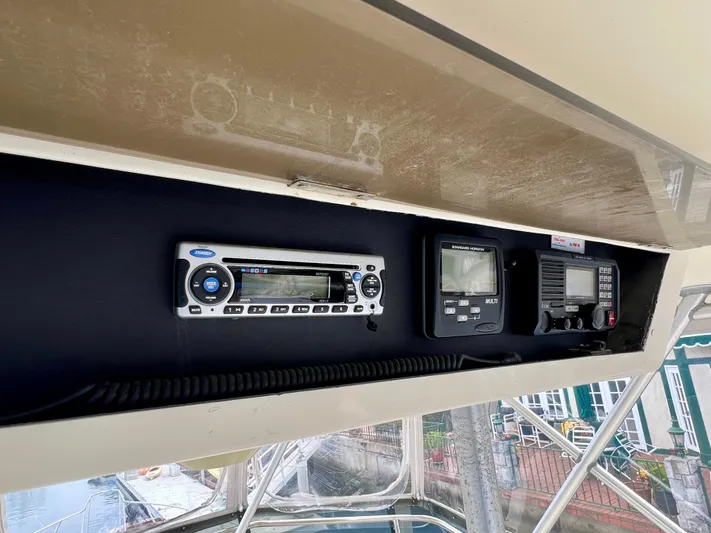 White Shark Yacht Photos Pics Control panel of 1988 Hatteras 48 Convertible yacht with navigation and communication equipment.