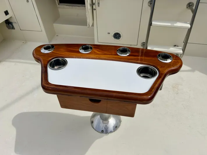 White Shark Yacht Photos Pics Fishing station on 1988 Hatteras 48 Convertible yacht with rod holders and cup holders.