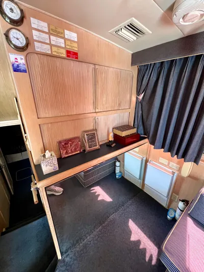 White Shark Yacht Photos Pics Interior of 1988 Hatteras 48 Convertible yacht with wood cabinets and nautical decor.