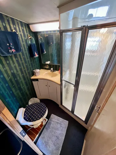 White Shark Yacht Photos Pics Bathroom interior of 1988 Hatteras 48 Convertible yacht with shower and vanity.