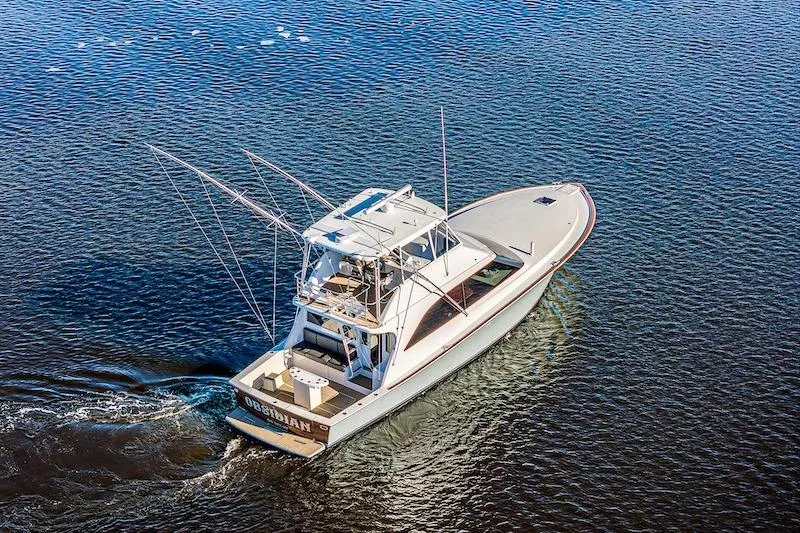 Obsidian Yacht Photos Pics Aerial view of 1991 Ocean Yachts 53 Super Sport cruising on open water.