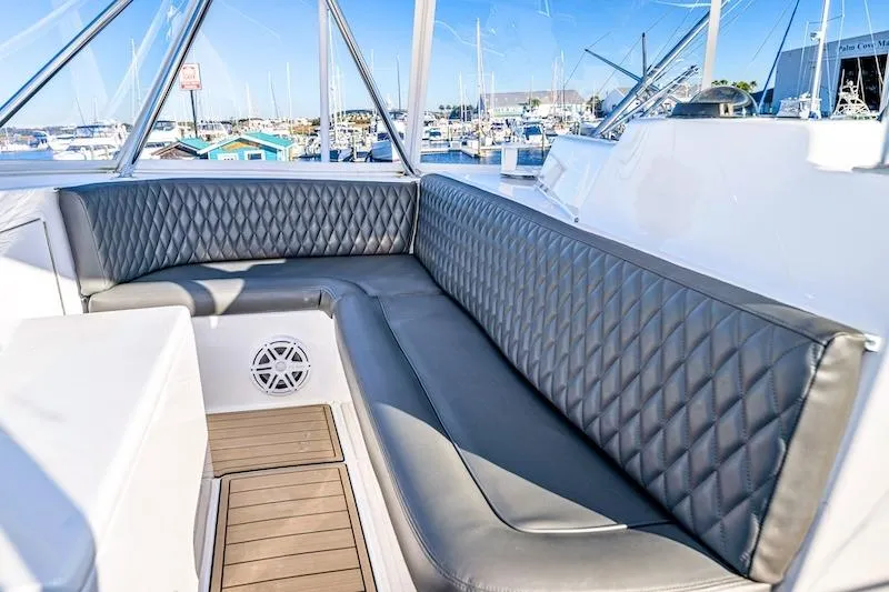 Obsidian Yacht Photos Pics Luxurious seating area on a 1991 Ocean Yachts 53 Super Sport, docked at a marina.