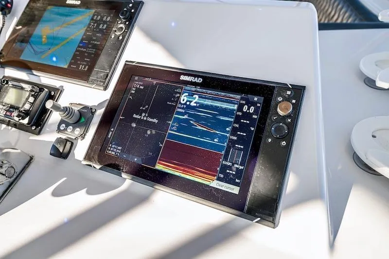 Obsidian Yacht Photos Pics Control panel of a 1991 Ocean Yachts 53 Super Sport with Simrad navigation displays.