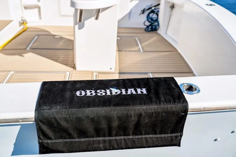 Obsidian Yacht Photos Pics 1991 Ocean Yachts 53 Super Sport deck with "Obsidian" cover, featuring sleek design.