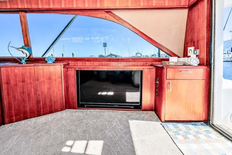 Obsidian Yacht Photos Pics Interior of 1991 Ocean Yachts 53 Super Sport with wood cabinetry and large window.