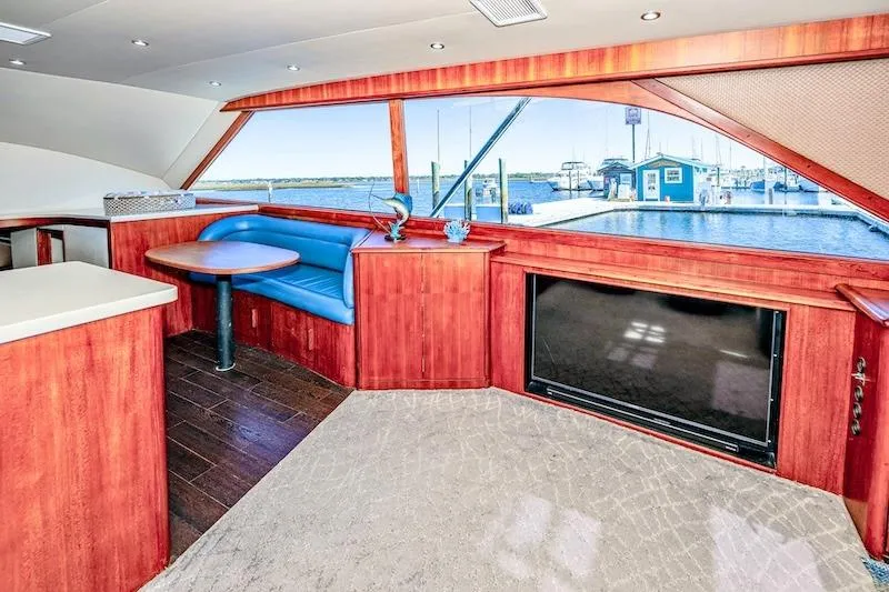 Obsidian Yacht Photos Pics Interior of 1991 Ocean Yachts 53 Super Sport with wood finish and marina view.