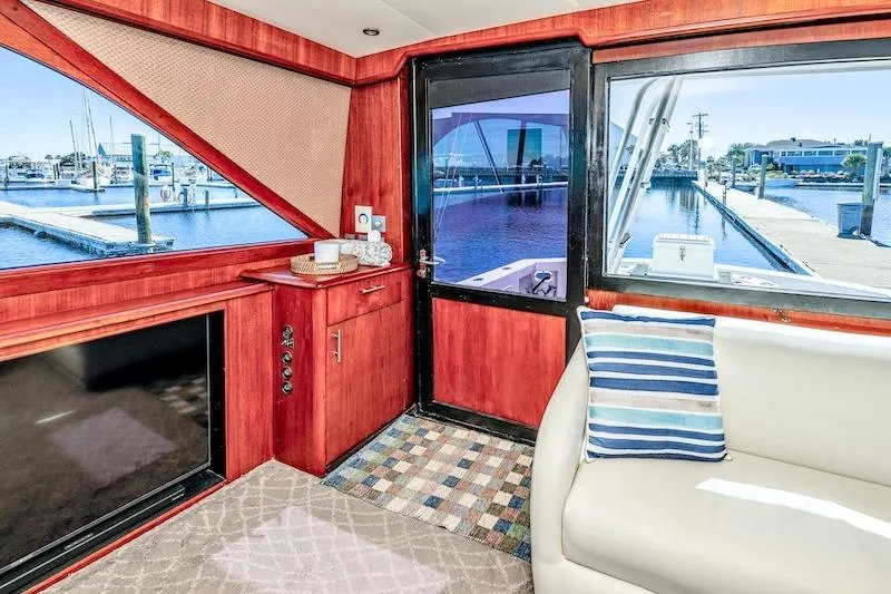 Obsidian Yacht Photos Pics Interior of 1991 Ocean Yachts 53 Super Sport with marina view through windows.
