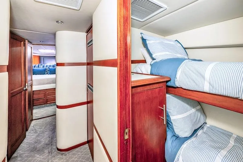 Obsidian Yacht Photos Pics Interior of 1991 Ocean Yachts 53 Super Sport with cozy bunk beds and wood accents.