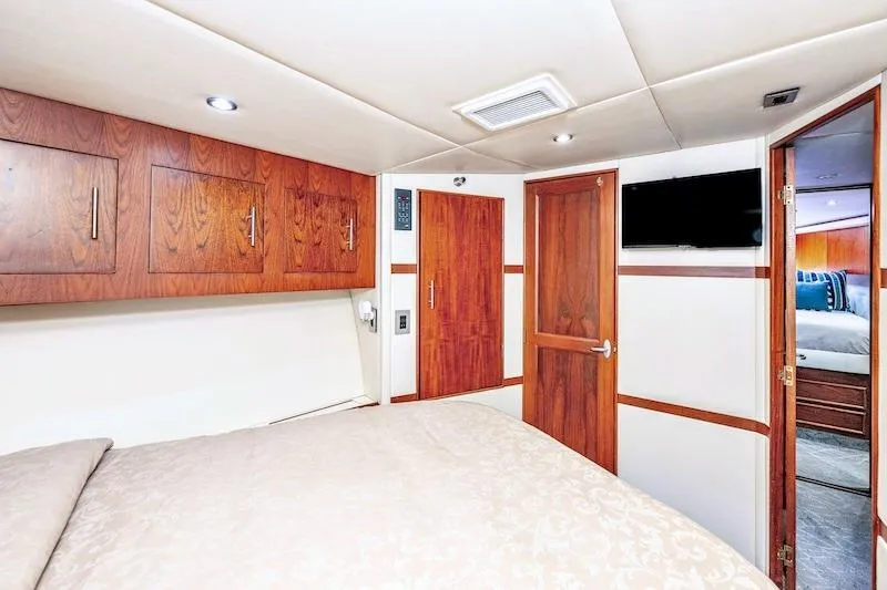Obsidian Yacht Photos Pics Luxurious cabin interior of 1991 Ocean Yachts 53 Super Sport with wood accents and modern amenities.