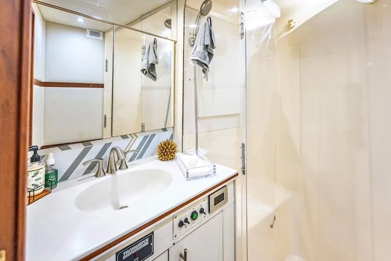 Obsidian Yacht Photos Pics Bathroom interior of 1991 Ocean Yachts 53 Super Sport with modern fixtures and shower.