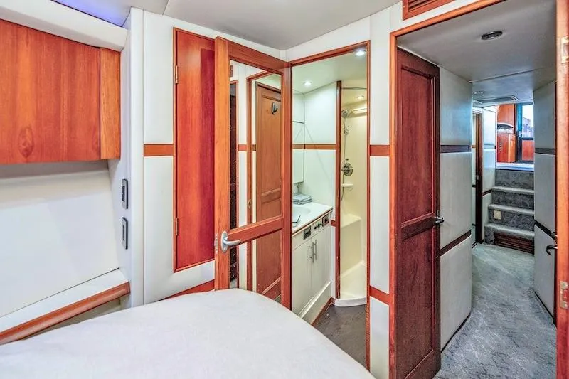 Obsidian Yacht Photos Pics Interior of 1991 Ocean Yachts 53 Super Sport, featuring wood accents and compact bathroom.