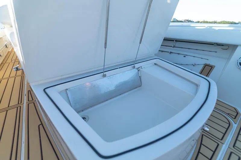 Liberado Yacht Photos Pics Open storage compartment on 2018 HCB 53 Suenos RXV boat deck.