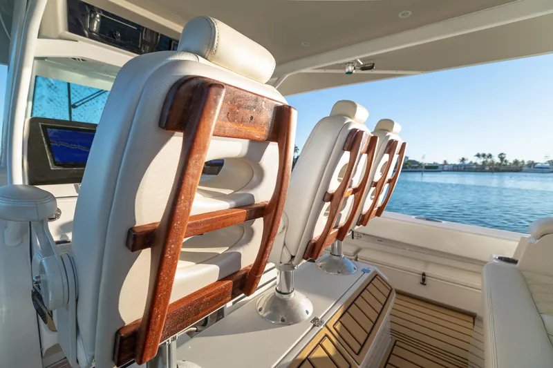 Liberado Yacht Photos Pics Luxury seating on 2018 HCB 53 Suenos RXV boat, overlooking serene water.