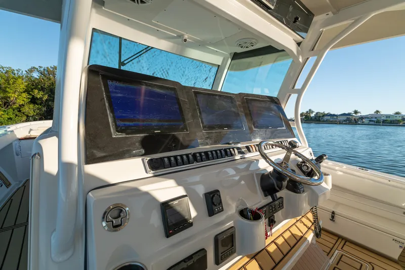 Liberado Yacht Photos Pics 2018 HCB 53 Suenos RXV boat helm with advanced navigation screens and steering wheel.