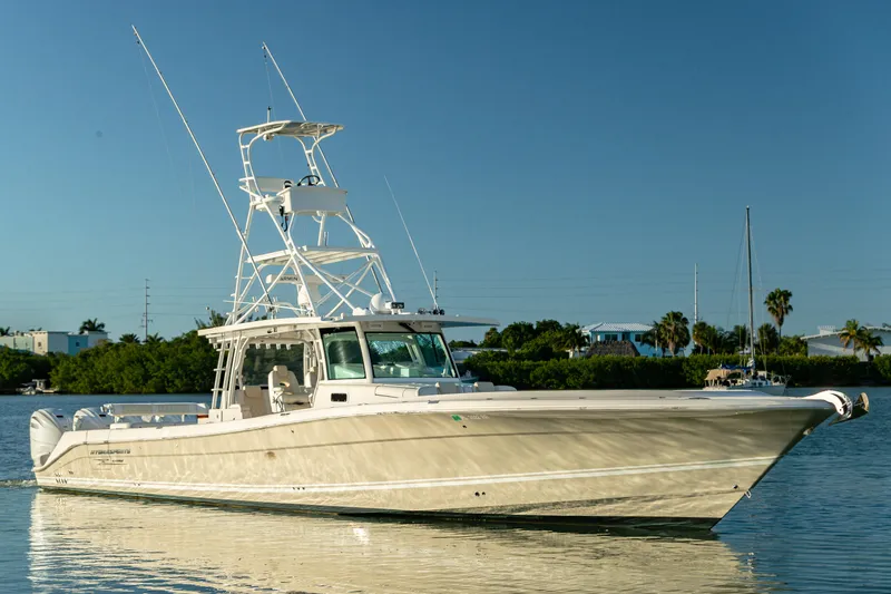 Liberado Yacht Photos Pics 2018 HCB 53 Suenos RXV boat on calm water, clear sky background.
