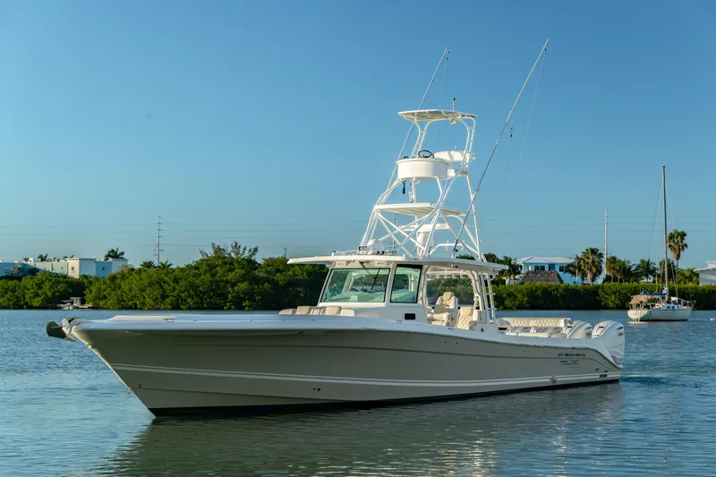 Liberado Yacht Photos Pics 2018 HCB 53 Suenos RXV boat on calm water, clear sky background.