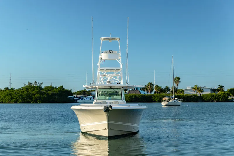 Liberado Yacht Photos Pics 2018 HCB 53 Suenos RXV boat on calm water, clear sky background.