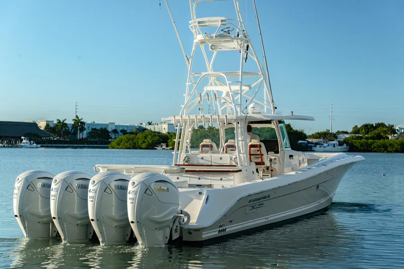 Liberado Yacht Photos Pics 2018 HCB 53 Suenos RXV boat with four Yamaha engines on calm water.