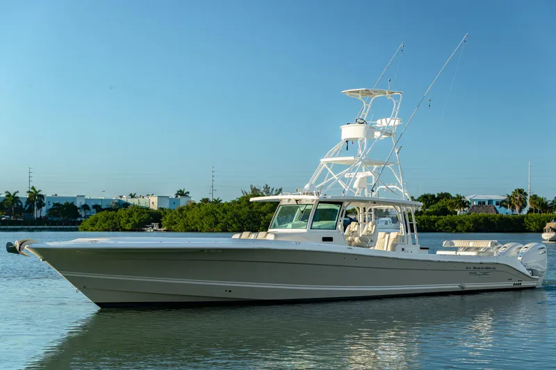 Liberado Yacht Photos Pics 2018 HCB 53 Suenos RXV boat on calm water, clear sky background.