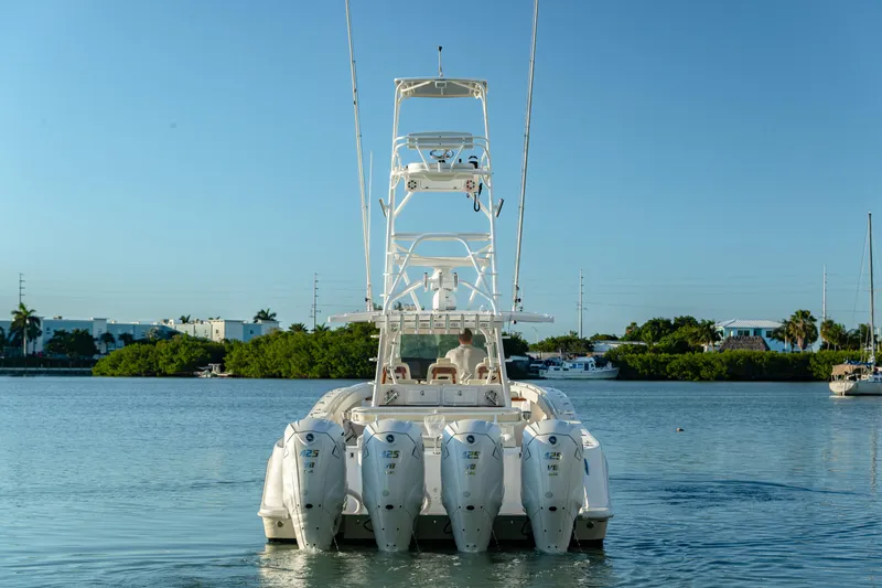Liberado Yacht Photos Pics 2018 HCB 53 Suenos RXV boat with multiple outboard engines on calm water.