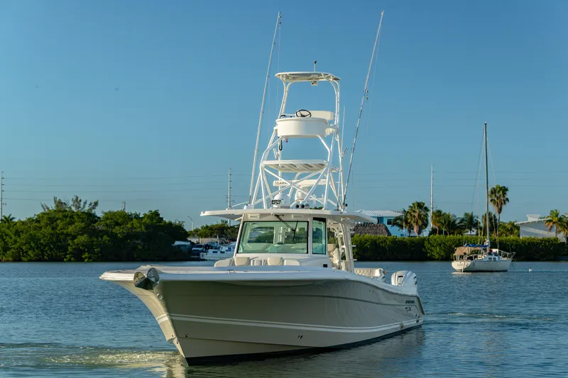 Liberado Yacht Photos Pics 2018 HCB 53 Suenos RXV boat cruising on calm water with clear blue sky.