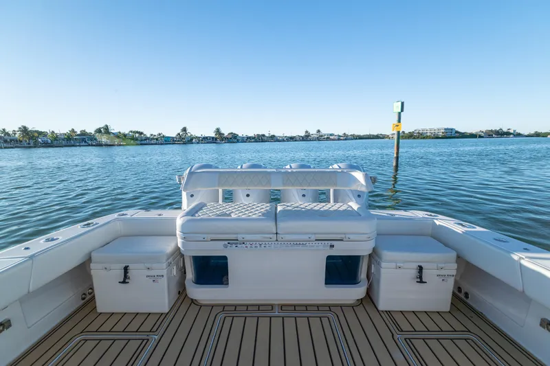 Liberado Yacht Photos Pics 2018 HCB 53 Suenos RXV boat interior with seating, on calm water.