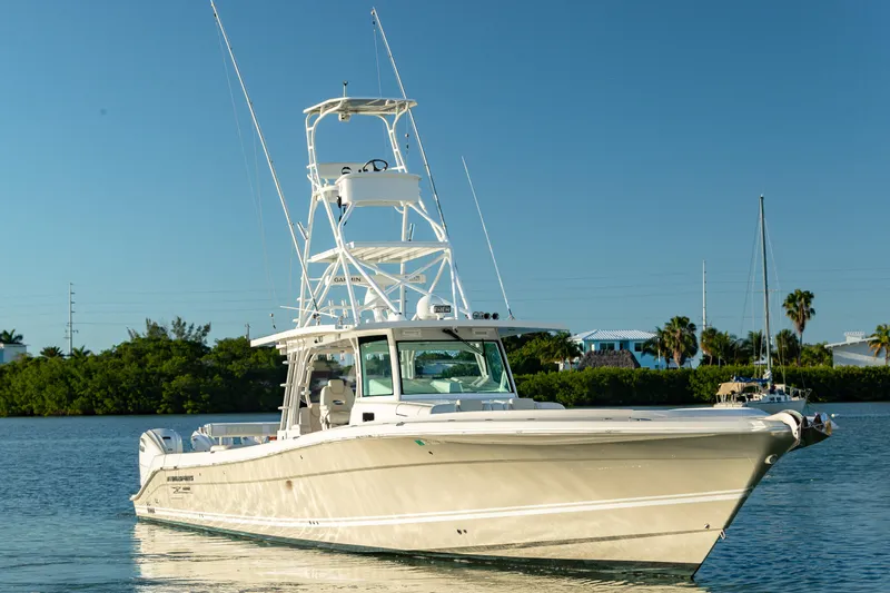 Liberado Yacht Photos Pics 2018 HCB 53 Suenos RXV boat on calm water, clear sky background.