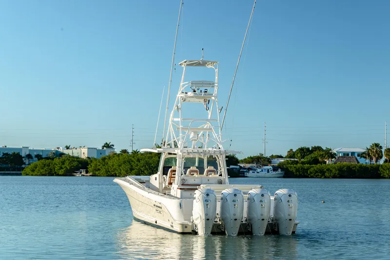 Liberado Yacht Photos Pics 2018 HCB 53 Suenos RXV boat with multiple engines on calm water.