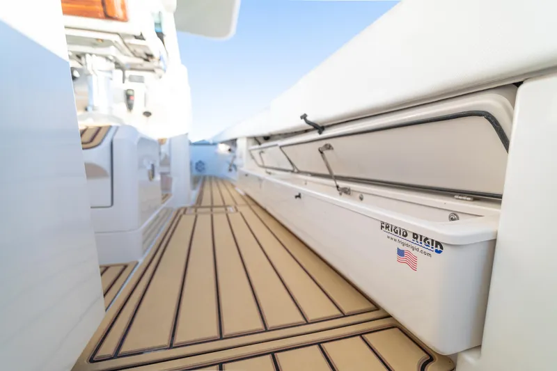 Liberado Yacht Photos Pics 2018 HCB 53 Suenos RXV boat interior with teak flooring and storage compartments.