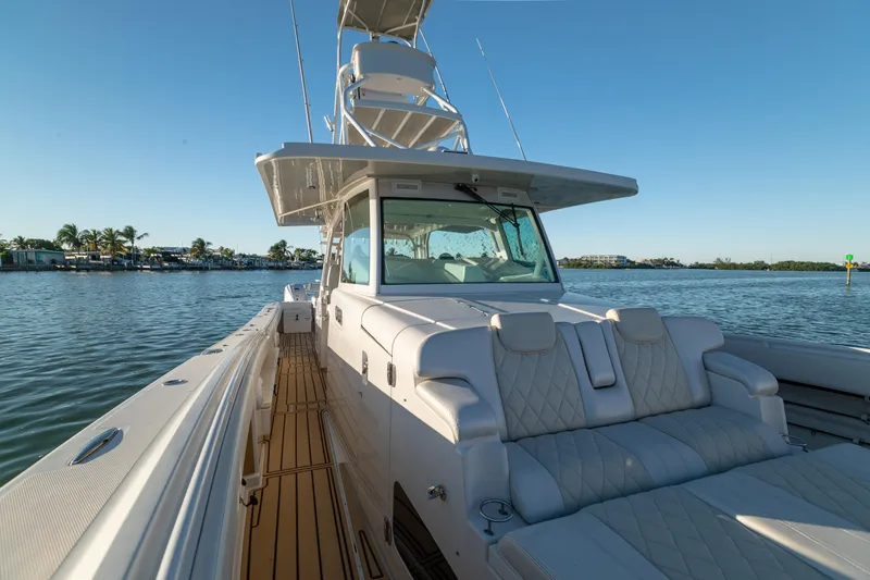 Liberado Yacht Photos Pics 2018 HCB 53 Suenos RXV luxury boat on calm water, sunny day.