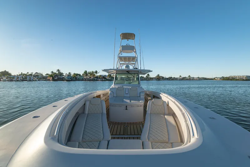 Liberado Yacht Photos Pics 2018 HCB 53 Suenos RXV luxury boat on calm water, featuring spacious seating and clear skies.