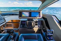 Cockpit of 2023 Pershing 7X yacht with modern navigation systems and ocean view.