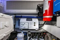 Engine room of 2023 Pershing 7X yacht, featuring advanced equipment and fire safety system.
