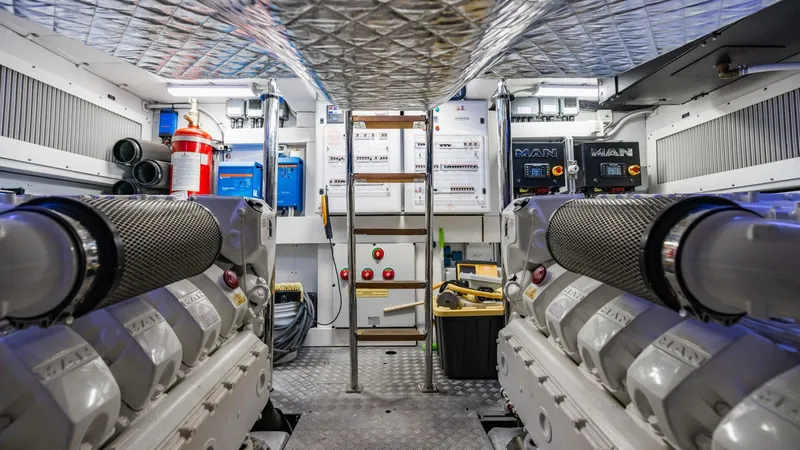 Unreel Yacht Photos Pics Engine room of 2023 Pershing 7X yacht, featuring advanced machinery and equipment.