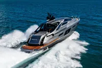 2023 Pershing 7X yacht cruising swiftly on open ocean waters.