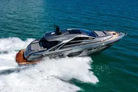 2023 Pershing 7X yacht cruising swiftly on open blue waters.