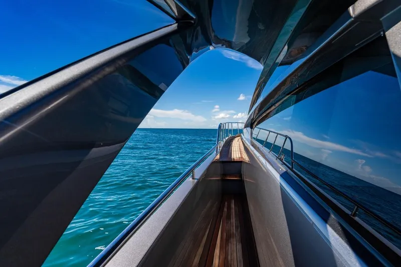 Unreel Yacht Photos Pics 2023 Pershing 7X yacht deck with ocean view and sleek design.