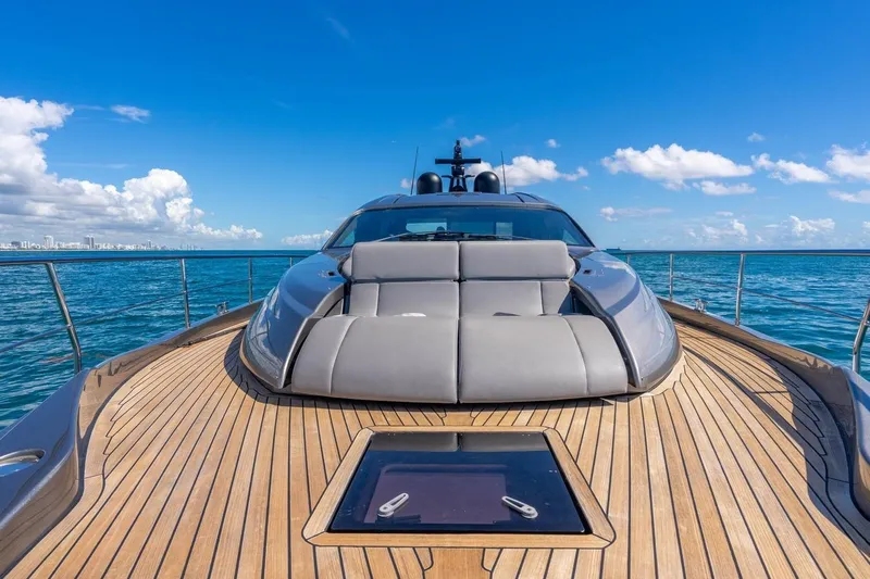 Unreel Yacht Photos Pics 2023 Pershing 7X yacht with sleek deck design on open sea under blue sky.