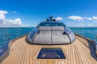 2023 Pershing 7X yacht with sleek deck design on open sea under blue sky.