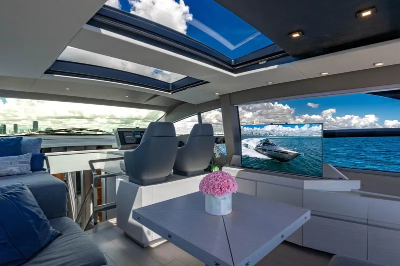 Unreel Yacht Photos Pics Luxurious interior of 2023 Pershing 7X yacht with panoramic views and modern design.