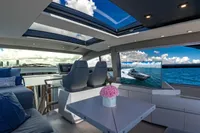 Luxurious interior of 2023 Pershing 7X yacht with panoramic views and modern design.