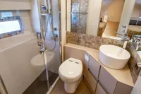 Luxurious bathroom in 2023 Pershing 7X yacht with modern fixtures and elegant design.