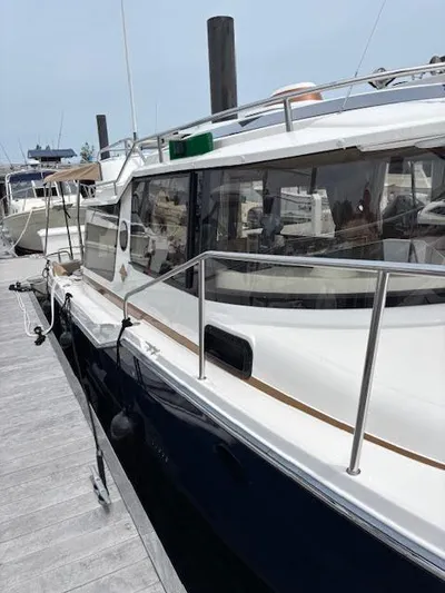 Marcia Jean Yacht Photos Pics 2023 Ranger Tugs R-29 S docked, showcasing sleek design and modern features.