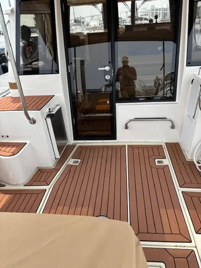 Marcia Jean Yacht Photos Pics 2023 Ranger Tugs R-29 S boat interior with teak flooring and modern design.