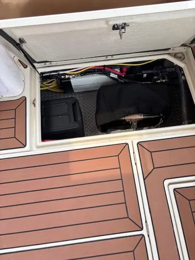 Marcia Jean Yacht Photos Pics 2023 Ranger Tugs R-29 S storage compartment with equipment and wooden deck flooring.