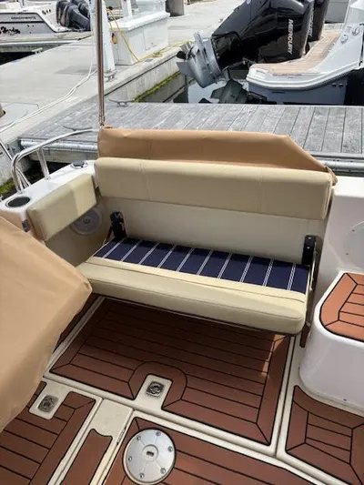Marcia Jean Yacht Photos Pics 2023 Ranger Tugs R-29 S boat with tan seating and wood-patterned deck.