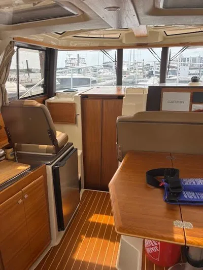 Marcia Jean Yacht Photos Pics Interior of 2023 Ranger Tugs R-29 S boat, featuring wood finishes and modern amenities.