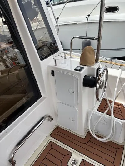 Marcia Jean Yacht Photos Pics 2023 Ranger Tugs R-29 S boat helm with steering wheel and controls.